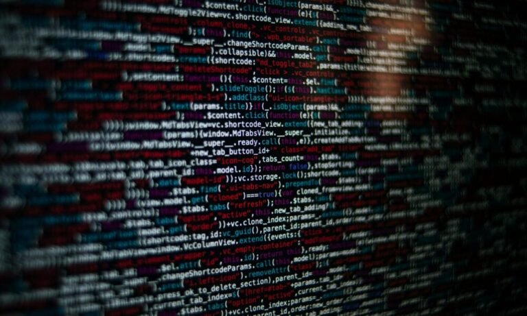 Blurred programming code on a screen representing digital tech concept for incestfl8x keyword